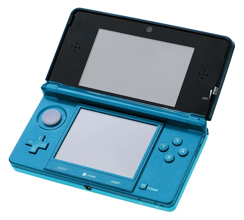 Nintendo 3DS family hardware shown in the reference photograph