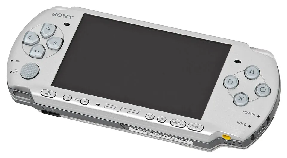 Silver PSP-3000 viewed from the front, the hardware model and colour included in the US Dissidia entertainment pack
