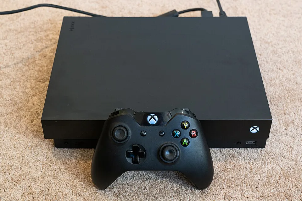 Xbox One X hardware shown in the reference photograph