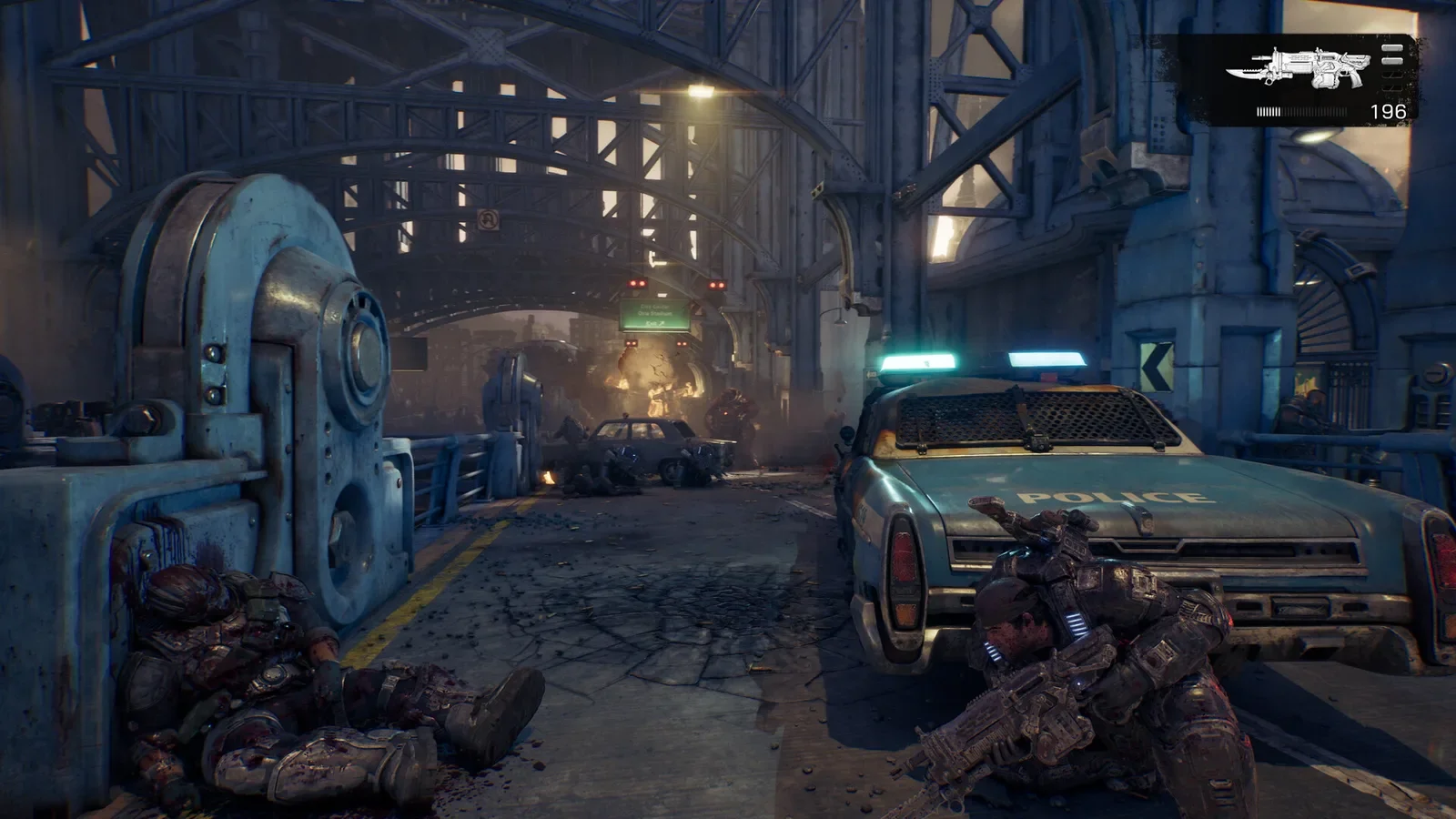 Official Gears of War: E-Day screenshot of a wounded COG soldier taking cover beside an abandoned car in Kalona