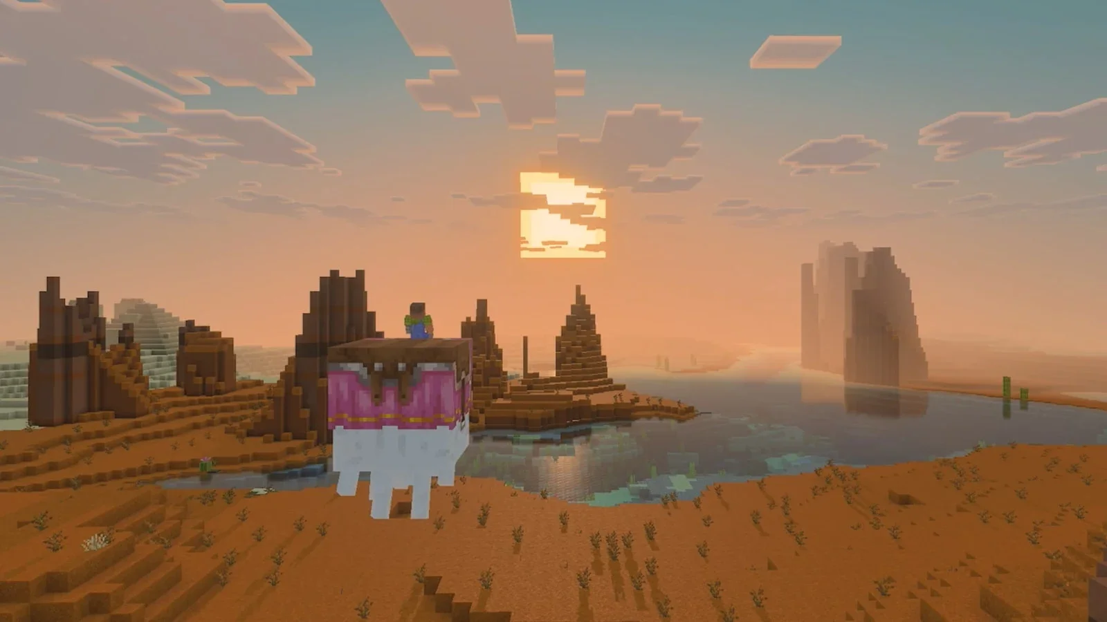 A Minecraft landscape at sunset with sandstone pillars, water and a pink-and-white creature in the foreground