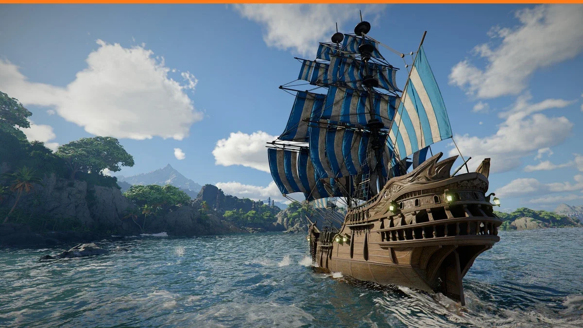 A wooden galleon with blue and white striped sails crossing a choppy blue sea past a rocky green coastline under white clouds