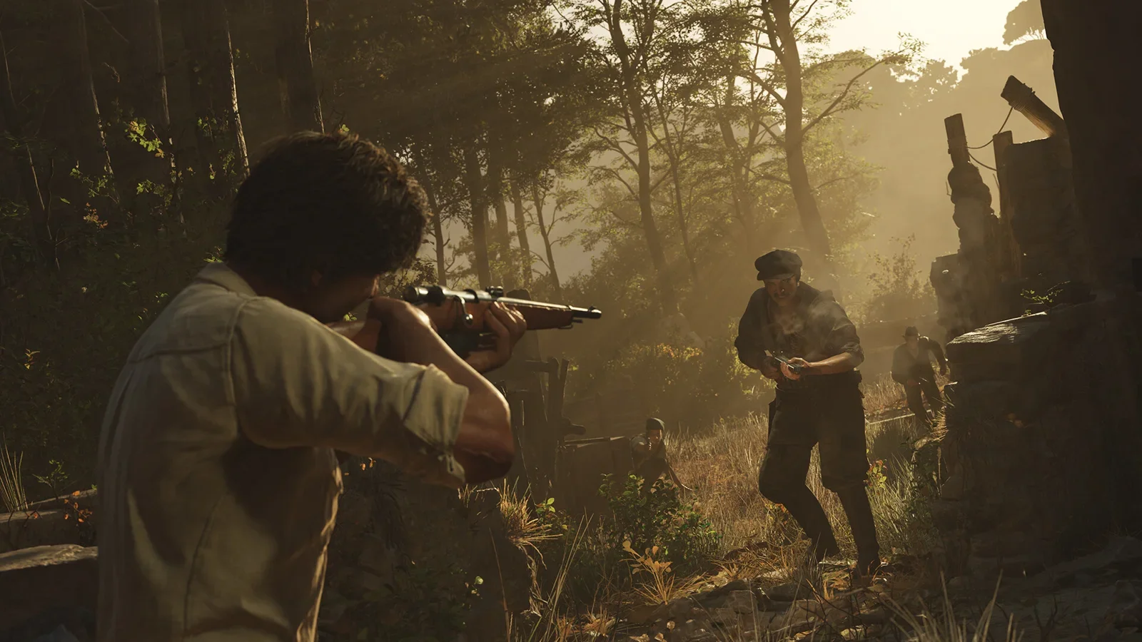 Official Mafia: The Old Country screenshot of Enzo aiming a rifle in a sunlit Sicilian forest beside an ally