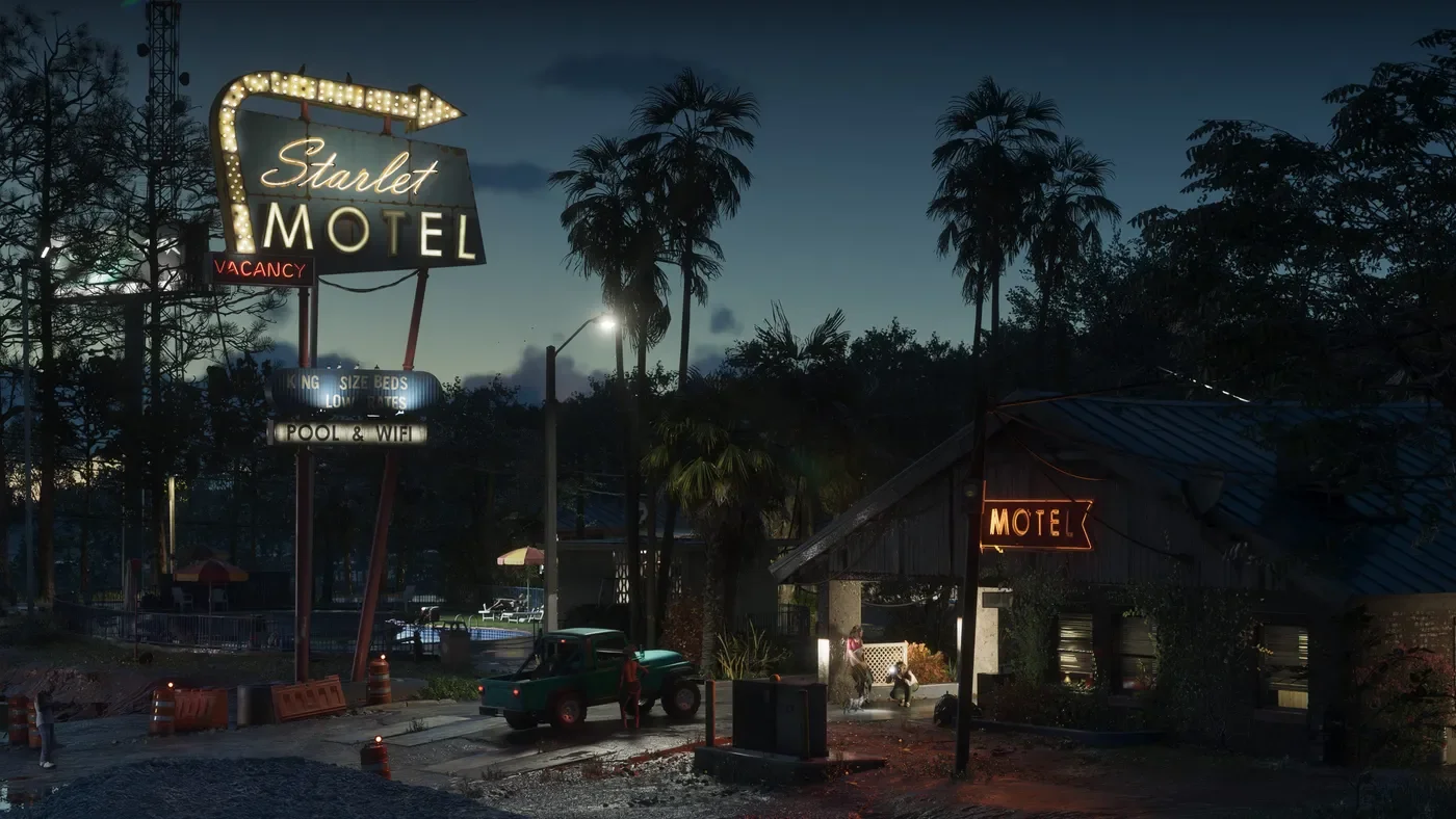 The Starlight Motel and palm-lined road in Port Gellhorn at night.