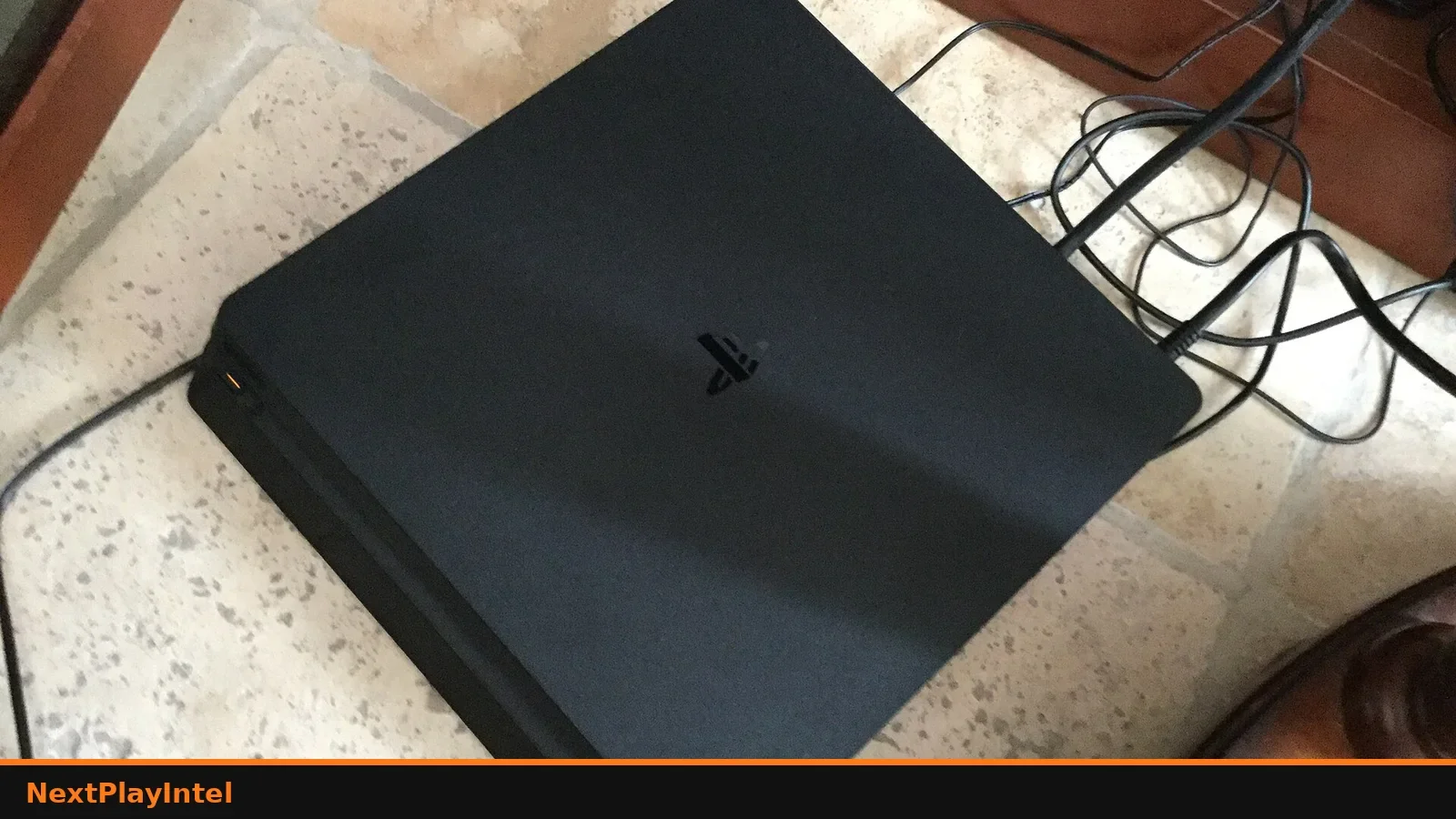 Black PlayStation 4 Slim console on a table