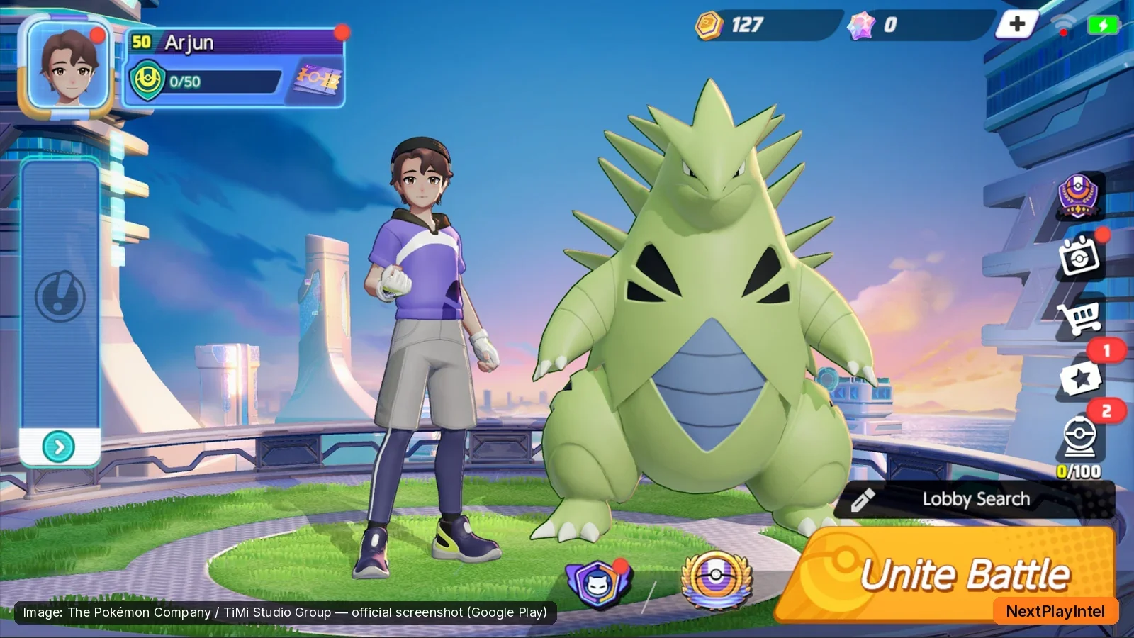 Pokémon UNITE home screen with trainer, Tyranitar and the Unite Battle button